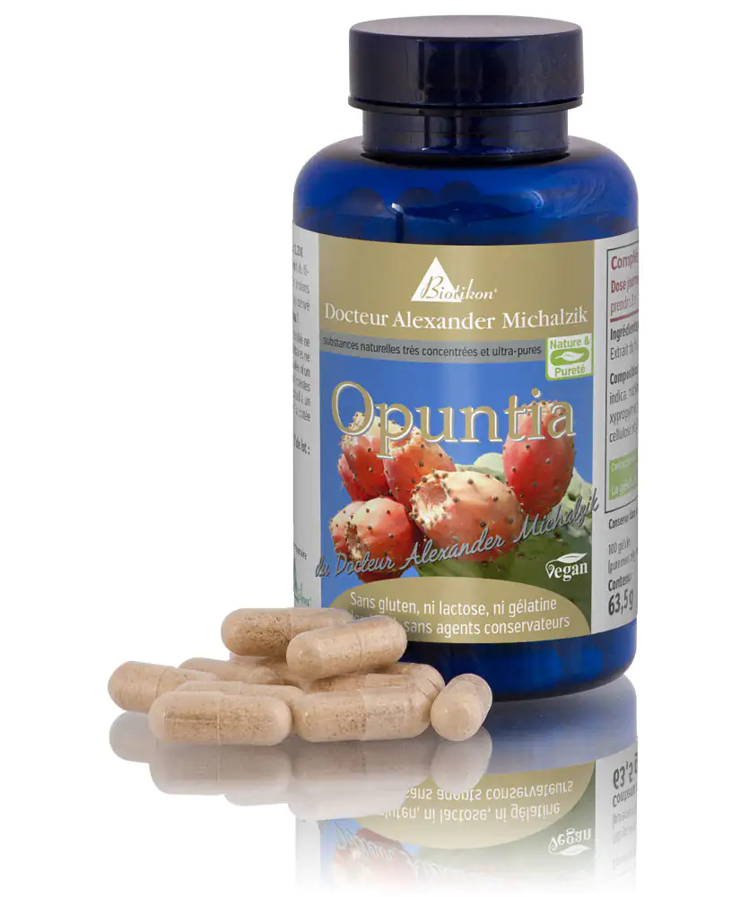Capsules Opuntra - 100 unités, Vegan & Sans Gluten Capsules Opuntra dans une bouteille bleue, 100 unités, contenu vegan, sans gluten, capsules beiges sur table.
