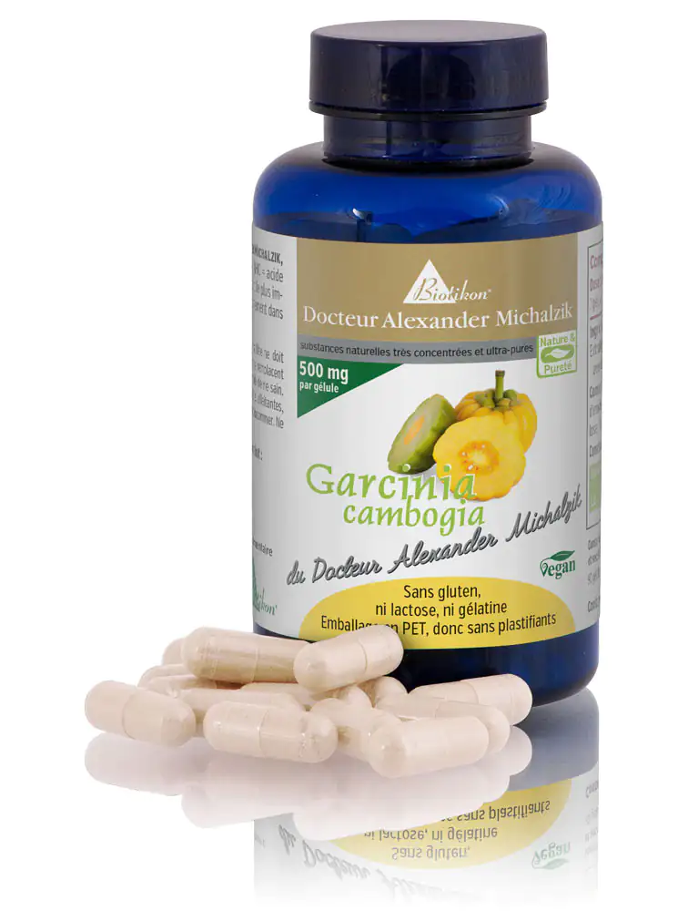 Garcinia Cambogia 500 mg – Capsules Bouteille de capsules de Garcinia Cambogia, 500 mg chacune, emballage PET bleu, plusieurs capsules au premier plan.